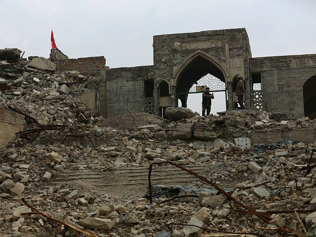 People inspect the destroyed Mosque of The Prophet Younis, or Jonah, in Mosul, Iraq, Saturday, Jan. 21, 2017. The revered Muslim shrine was destroyed on 2014 by Islamic State militants who overran the city and imposed their harsh interpretation of Islamic law. The mosque was built on an archaeological site dating back to 8th century BC, and is said to be the burial place of the prophet, who in stories from both the Bible and Quran is swallowed by a whale. (AP Photo/Khalid Mohammed)