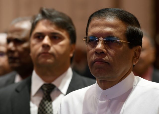Sri Lanka's President Maithripala Sirisena (right) pictured in Colombo on December 19, 201