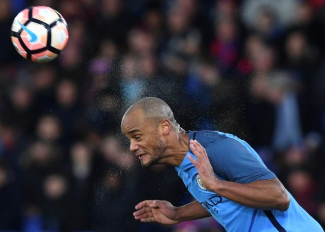Manchester City's defender Vincent Kompany heads the ball during the English FA Cup fourth