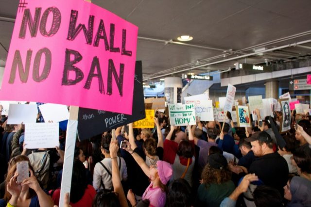 Protesters gather at the Los Angeles International airport's to demonstrate against Presid