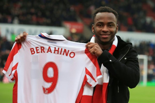 Saido Berahino poses with his Stoke City jersey at the Bet365 Stadium in Stoke-on-Trent on