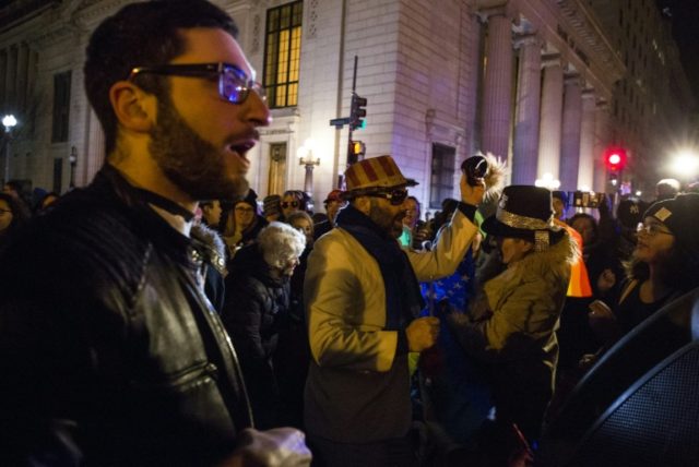 Demonstrators march from the Trump Hotel International Washington to The White House to pr