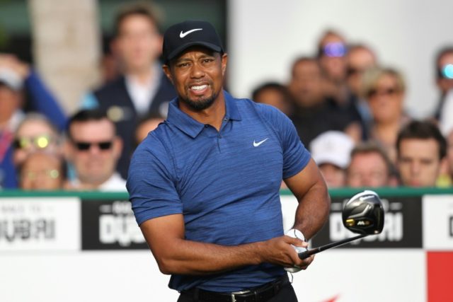 Tiger Woods of the United States reacts after playing a shot during the Dubai Desert Class