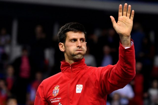 Serbia's tennis player Novak Djokovic reacts after winning against Russia's tennis player