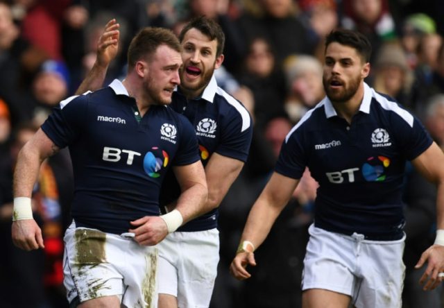Scotland's Stuart Hogg (L) celebrates after scoring their first try during the Six Nations
