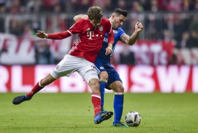 Bayern Munich's Thomas Mueller and Schalke's Sead Kolasinac vie for the ball during their