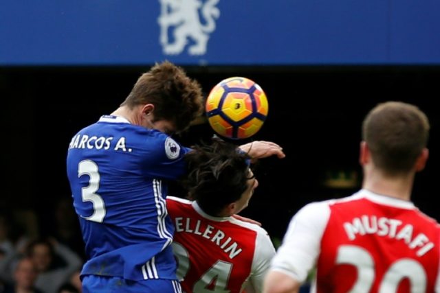 Chelsea's Marcos Alonso rises above Arsenal's Hector Bellerin to score the opening goal du