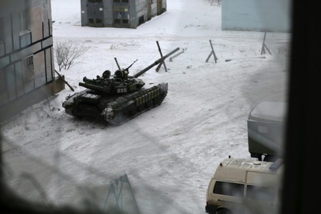 A Ukrainian Forces tank is stationed outside a building in the flashpoint eastern town of