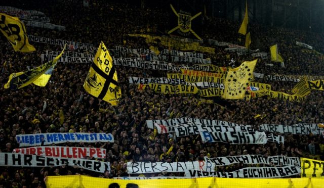 Supporters of Borussia Dortmund display banners during their match at home against Leipzig