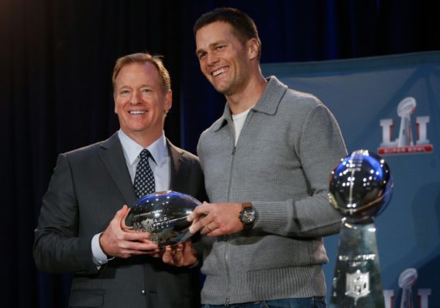 NFL Commissioner Roger Goodell (L), awards New England Patriots' Tom Brady the Pete Rozell