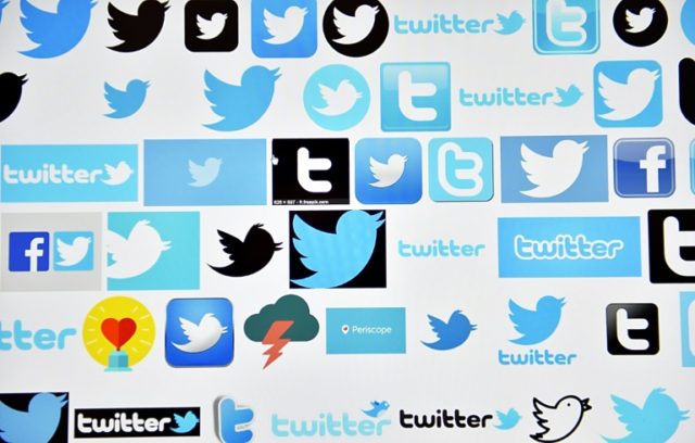 Twitter reports sluggish revenue and user growth, with widening losses in the past quarter