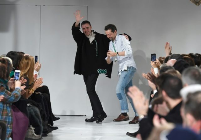 Designers Raf Simons (L) and Pieter Mulier walk the runway at the Calvin Klein show at New