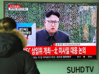 A man watches the news showing file footage of North Korean leader Kim Jong-Un at a railway station in Seoul on February 12, 2017
