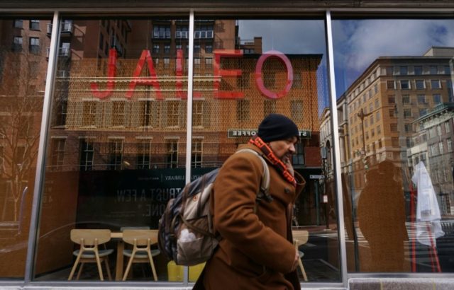 Pedestrians pass by a restaurant closed for a "Day Without Immigrants" in protest of US Pr