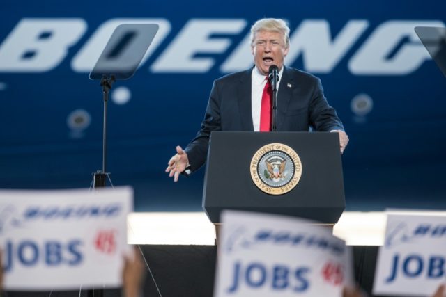 US President Donald Trump addresses a crowd during the debut event for the Dreamliner 787-