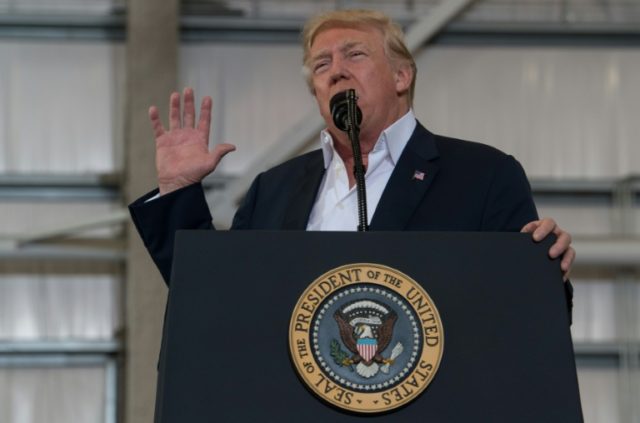 US President Donald Trump addresses a rally at the Orlando Melbourne International Airport