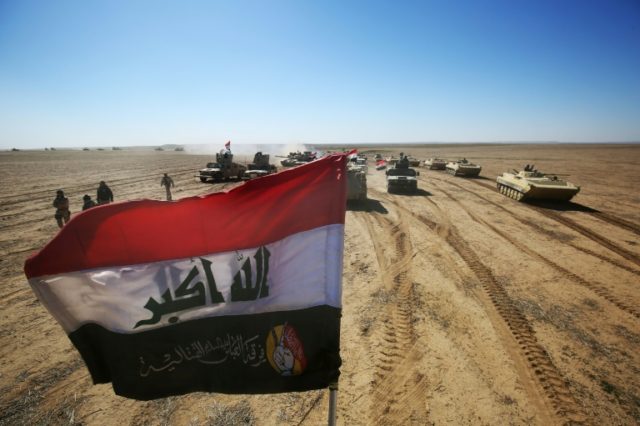 Iraqi forces advance near the village of Sheikh Younis, south of Mosul