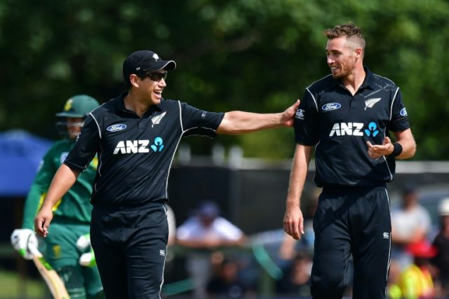 New Zealand's Tim Southee (R) receives a pat on the back from teammate Ross Taylor during