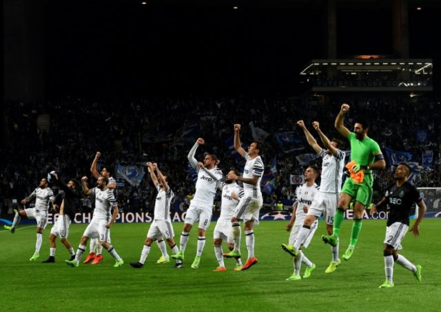 Juventus' players celebrate their 2-0 victory against Porto at the end of the UEFA Champio