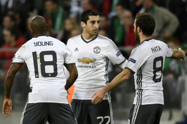 Manchester's United's Henrikh Mkhitaryan (C) celebrates with teammates after scoring a goa