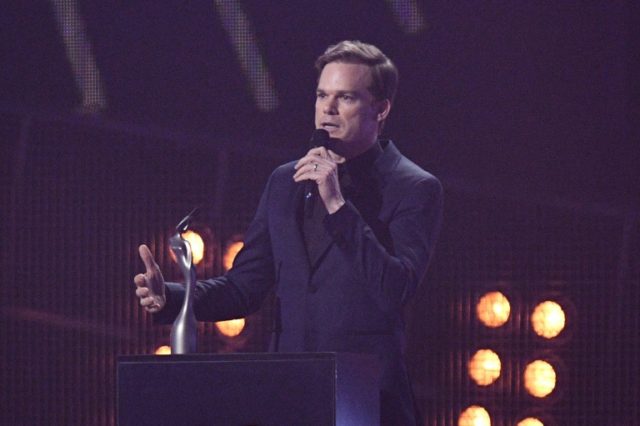 US actor Michael C Hall talks as he collects the award for British male solo artist on beh