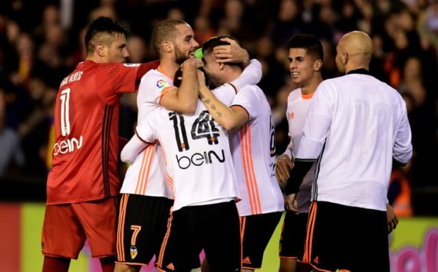 Valencia's players celebrates after their Spanish league football match against Real Madri