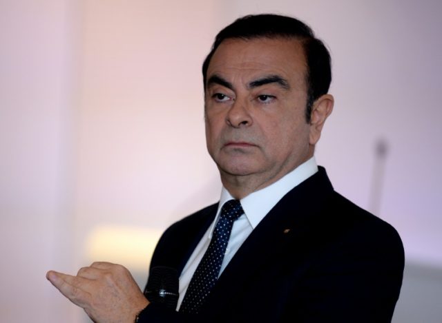 Carlos Ghosn, CEO of French automaker Renault, gestures during the presentation of the gro