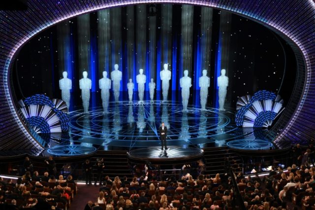 Host Jimmy Kimmel performs on stage inside the Dolby theatre at the 89th Oscars on Februar