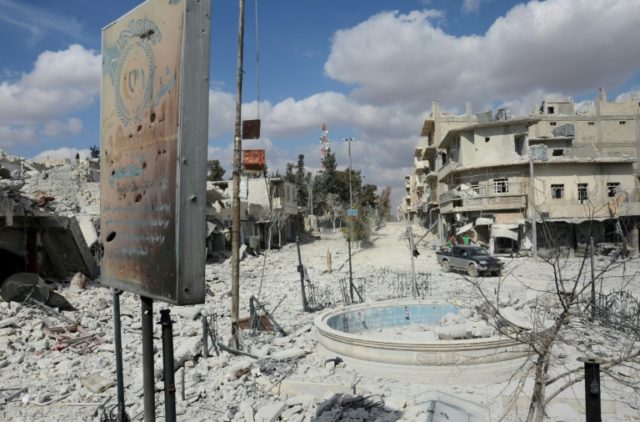 A general views shows a severely damaged street in the northwestern border town of al-Bab