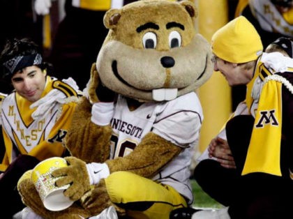 Minnesota mascot Goldie Gopher, center, performs with members of the marching band during the second half of a NCAA college football game, Saturday Oct. 30, 2010 in Minneapolis. Ohio State won 52-10. (AP Photo/Paul Battaglia)