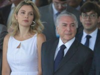 Brazil-President-Michel-Temer-wife-Marcela-ap Brazil's President Michel Temer, center, and wife Marcela Temer, watch an Independence Day military parade in Brasilia, Brazil, Wednesday, Sept. 7, 2016. Pictured right is Lower House Speaker Rodrigo Maia. (AP Photo/Eraldo Peres)