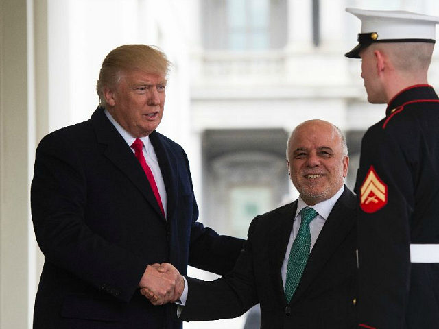 US President Donald Trump greets Iraqi Prime Minister Haider Al-Abadi as he arrives to the
