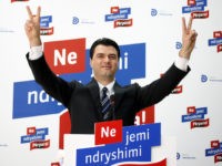 ALBANIA-POLITICS-ELECTION-PARTIES-BASHA Lulzim Basha, the newly elected leader of the Democratic Party (DP), soon to be in opposition after the June 23rd general elections, flashes "V for victory" signs during a press conference in Tirana on July 23, 2013. Basha won with 80 percent of the votes an internal race for the …