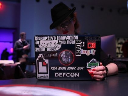 NEW YORK, NY - APRIL 15: A hacker using a laptop computer at the Hacked By Def Con Press