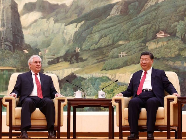 China's President Xi Jinping (R) meets with US Secretary of State Rex Tillerson (L) a