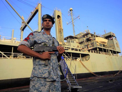 An Iranian soldier stands guard near Iranian Navy helicopter carrier Kharg at Port Sudan at the Red Sea State, October 31, 2012. REUTERS/ Mohamed Nureldin Abdallah