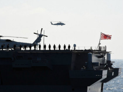 SH-60 helicopters are seen as Japan's Maritime Self-Defense Force (MSDF) escort ship Izumo