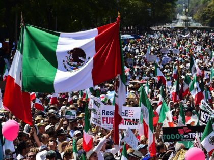 Thousands of Mexicans take part in an anti-Trump march in Mexico City, on February 12, 2017. Mexicans took to the streets against US President Donald Trump, hitting back at his anti-Mexican rhetoric and vows to make the country pay for his "big, beautiful" border wall. / AFP / RONALDO SCHEMIDT …