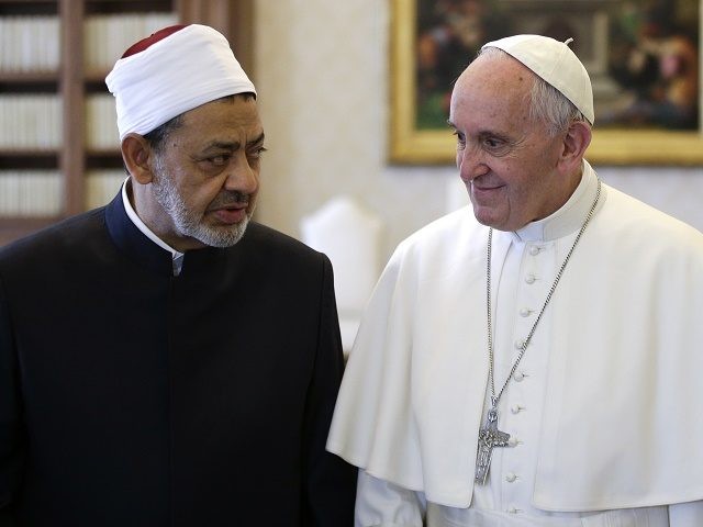 Pope Francis (R) talks with Egyptian Grand Imam of al-Azhar Mosque Sheikh Ahmed Mohamed al