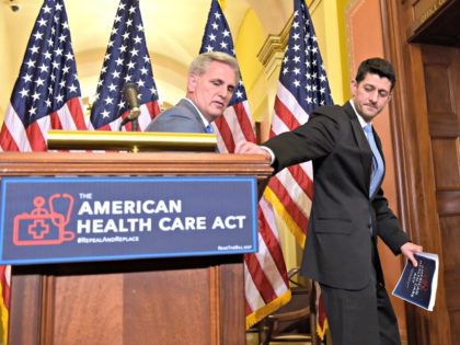 House Speaker Paul Ryan of Wis., right, takes his notes as he and House Majority Whip Kevin McCarthy, R-Calif., walk away following a news conference on the American Health Care Act on Capitol Hill in Washington, Tuesday, March 7, 2017. (AP Photo/Susan Walsh)