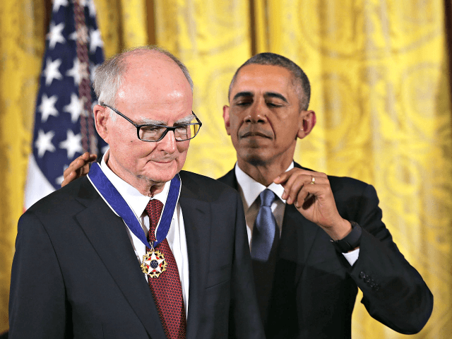 U.S. President Barack Obama (R) presents the Presidential Medal of Freedom to William Ruckelshaus (L), the first and fifth Administrator of the Environmental Protection Agency, during an East Room ceremony November 24, 2015 at the White House in Washington, DC.