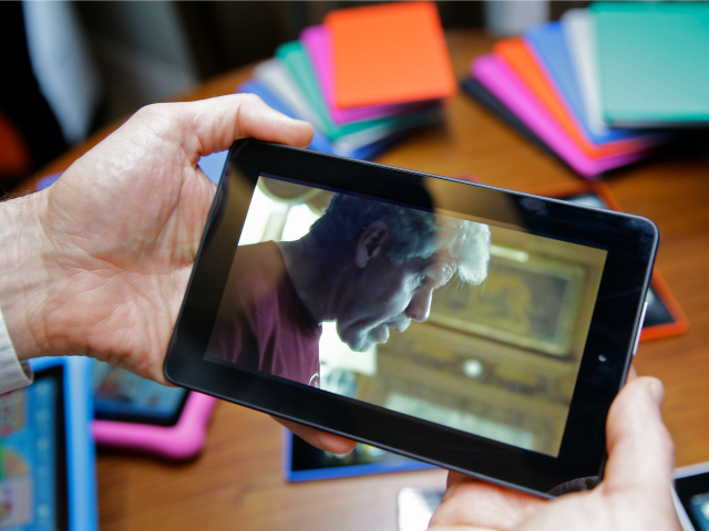 In this Wednesday, Sept. 16, 2015, photo, a video is played on Amazon's new $50 Fire