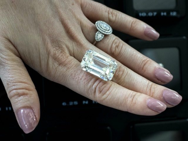 An Israeli buyer checks a 36,5 carat diamond valued at $1.5 million during the Internation
