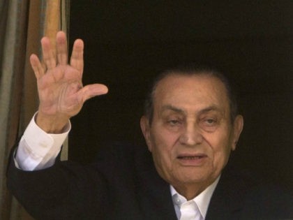 FILE - In this April 25, 2016 file photo, ousted Egyptian President Hosni Mubarak waves to his supporters from his room at the Maadi Military Hospital, where he is hospitalized, as they celebrate Sinai Liberation Day that marks the final withdrawal of all Israeli military forces from Egypt's Sinai Peninsula …