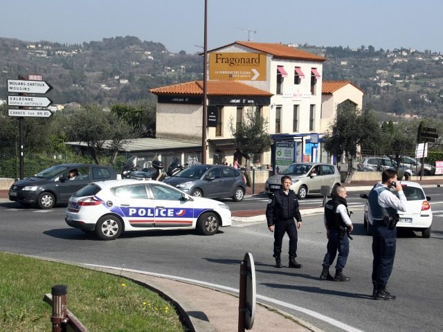 Police officers take position after an attack in a high school student in Grasse, southern