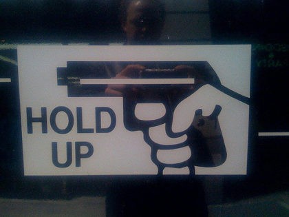 gun warning sign (evan p. cordes / Flickr / CC)
