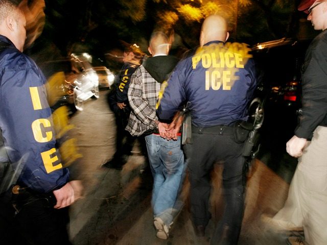 Immigration and Customs Enforcement (ICE) officers arrest a suspect during a pre-dawn raid in Santa Ana, Calif., in this file photo from Wednesday, Jan. 17, 2007. The Census Bureau plans to ask immigration enforcement officials to suspend raids during the 2010 census to help improve accuracy in counting illegal immigrants. …