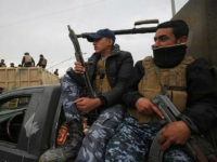 Iraqi security forces patrol an area that was recently retaken in western Mosul, on March 15, 2017, as troops continue to advance in the embattled city combatting Islamic State (IS) group jihadists. / AFP PHOTO / AHMAD AL-RUBAYE (Photo credit should read AHMAD AL-RUBAYE/AFP/Getty Images)