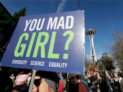 Protesters fill the street and pass the Space Needle during a women's march that brought tens of thousands Saturday, Jan. 21, 2017, in Seattle. Women across the Pacific Northwest marched in solidarity with the Women's March on Washington and to send a message in support of women's rights and other …