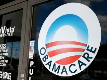 An Obamacare logo is shown on the door of the UniVista Insurance agency in Miami, Florida
